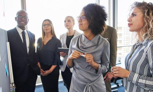 african american woman leads a business team