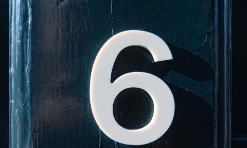 number six on a blue wooden door