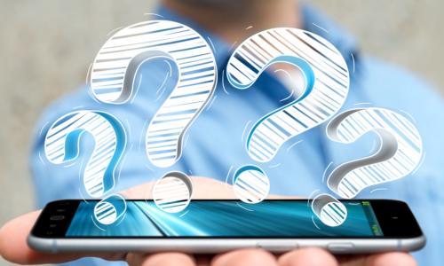 man holding smart phone with question marks above it