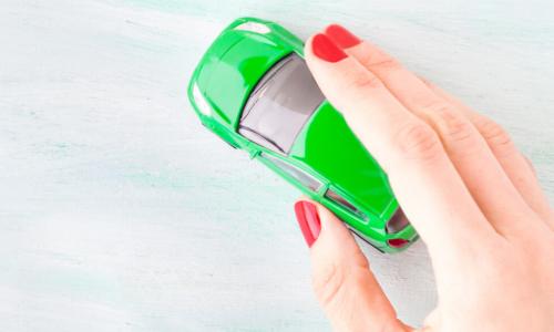 Toy car in woman's hand