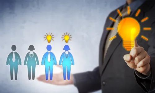 man touching light bulb on screen