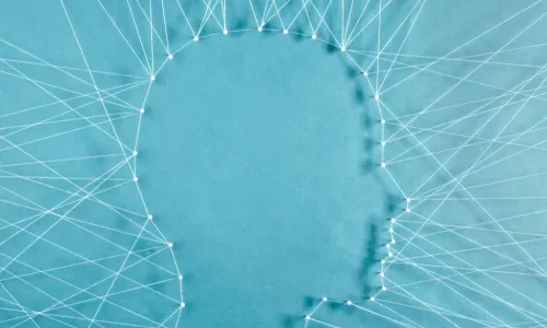 facial profile of a person outlined in string on blue background