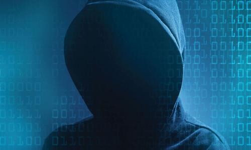 shadowy hacker figure in a dark hoodie