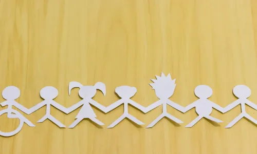 paper cutouts of diverse people united by a single cause