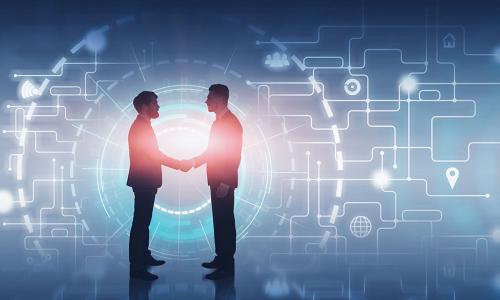 two businessmen shaking hands in front of glowing digital background