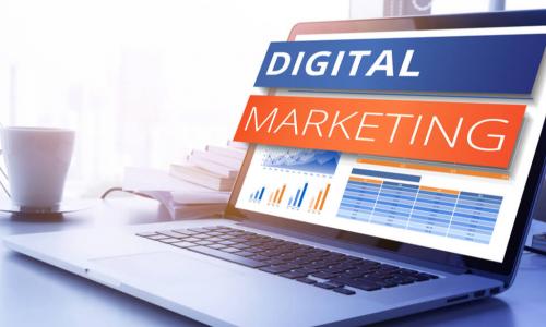 the words digital marketing popping out of a laptop screen