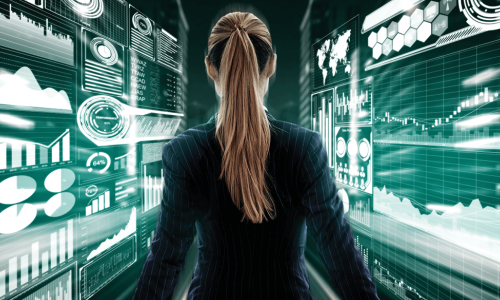 female business executive surrounded by digital dashboards