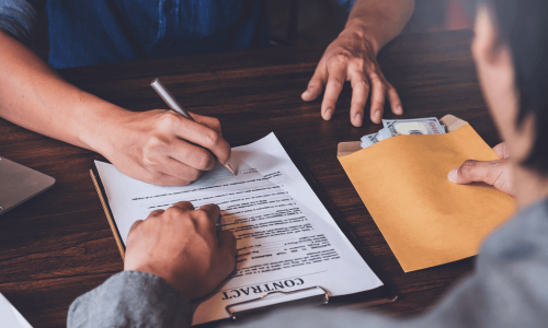 Man signs a loan agreement with a loan officer