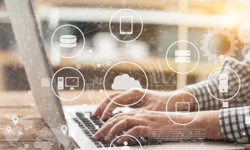 connected icons representing customer information floating above image person typing on a laptop