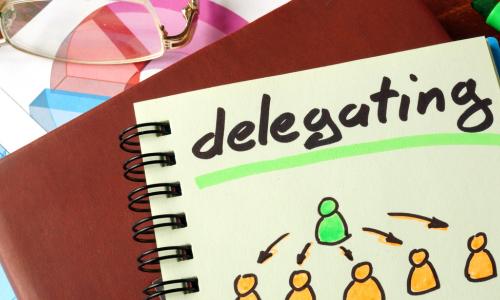 Notebook with delegating sign