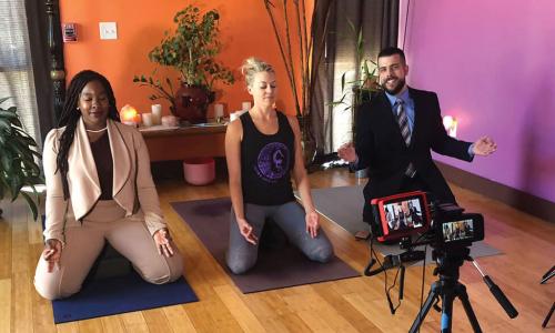 SAFE Credit Union employees doing yoga with local studio owner