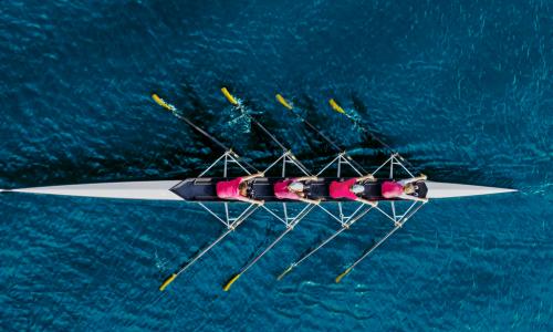 crew team rows on water