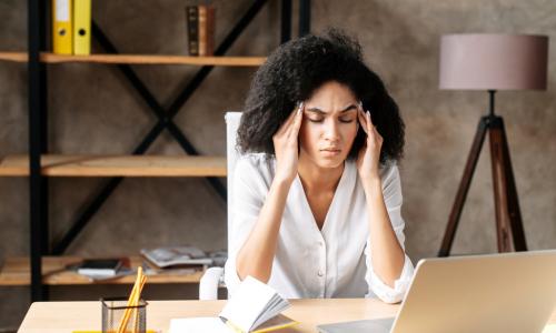 young Black professional woman feeling stressed