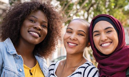smiling group of three diverse women