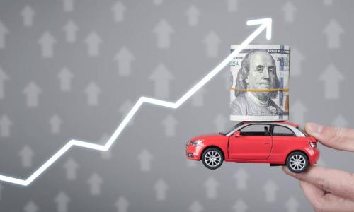 holding car with money and graph