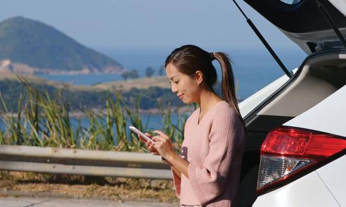 smiling young woman using smartphone while leaning against open hatch of SUV at highway scenic overlook<p>Have branch, will travel” is the new slogan for many credit union members.&nbsp;</p>  <p>A growing number of members prefer to take their favorite branch with them everywhere they go, keeping it handy for when they need to deposit a check, transfer money between accounts or review their balances.</p>  <p>If that sentence left you with the image of a person burdened by a branch on their back, think again
