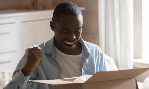 man excited about box delivery