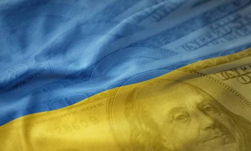 Ukraine flag flowing over US currency