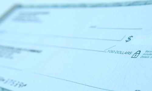 close-up image of a blank bank check or cheque