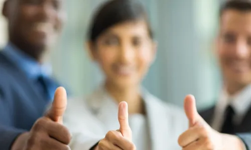 diverse executives thumbs up