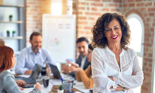 mature leader at meeting table