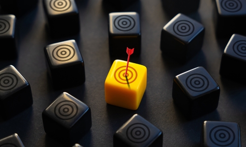 yellow target block with arrow dead center surrounded by black target blocks 