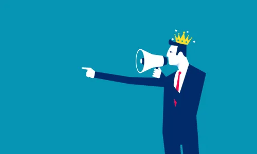 man with a crown on yelling into a megaphone