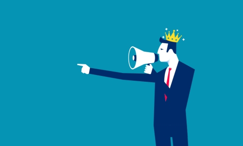 man with a crown on yelling into a megaphone