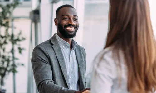 gentleman shaking hands with a female