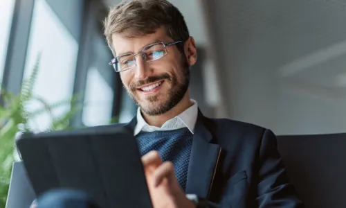 man working on his tablet