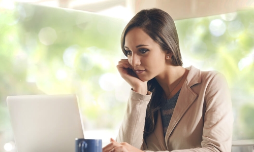 woman looking at laptop