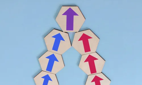 arrow blocks pointing up. blue on left, red on right come together as purple at the top