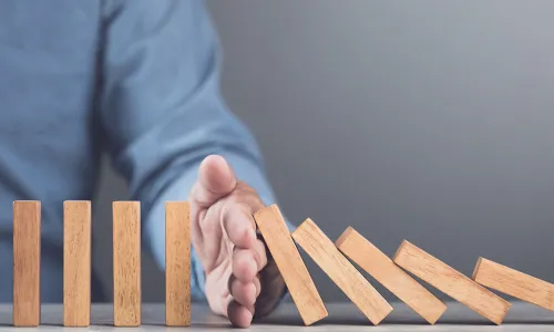 hand stops wooden dominoes