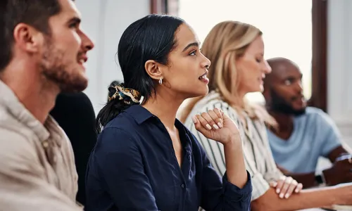 interns eagerly looking ahead at someone speaking